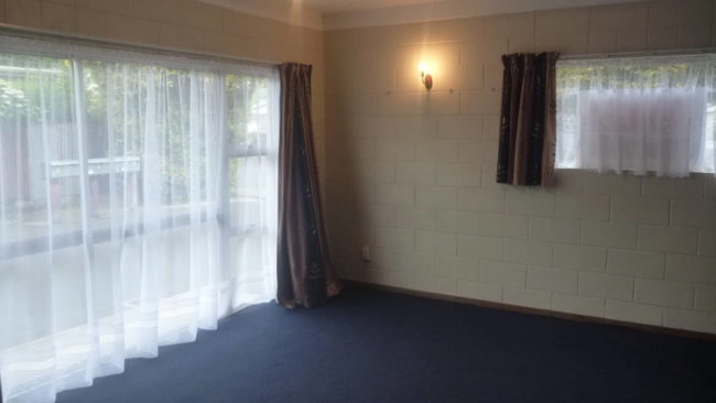 living area from doorway through to bathroom